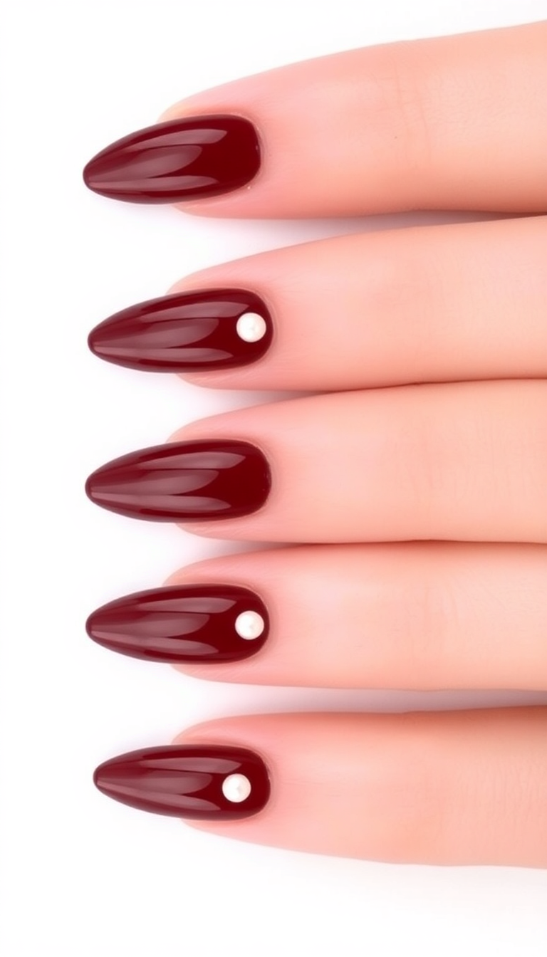 13. Burgundy Almond Nails with Pearl Accents